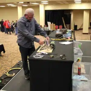 Man demonstrating equipment at a workshop.