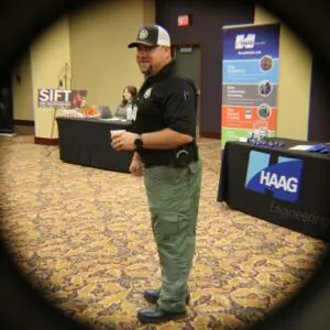 Man standing at engineering and investigations conference.